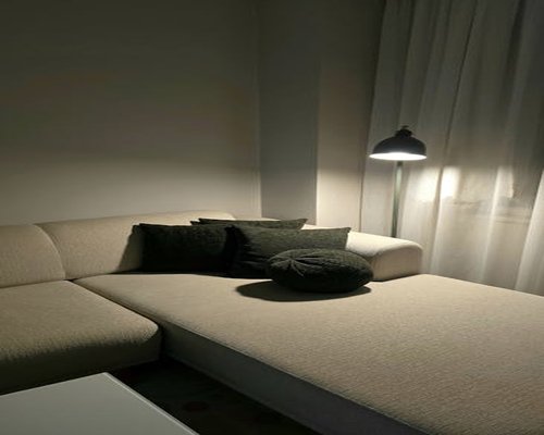 A quiet living room with soft lighting for resting